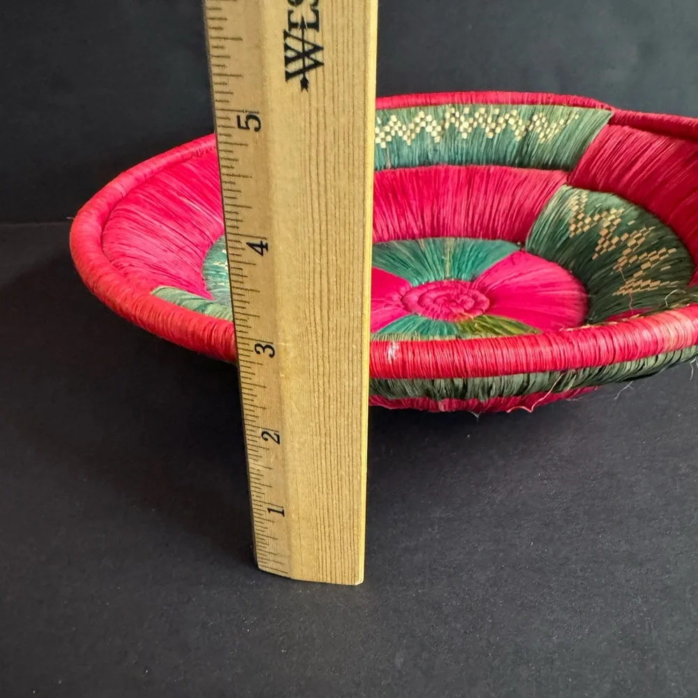Vintage hand woven festive red and green straw African basket